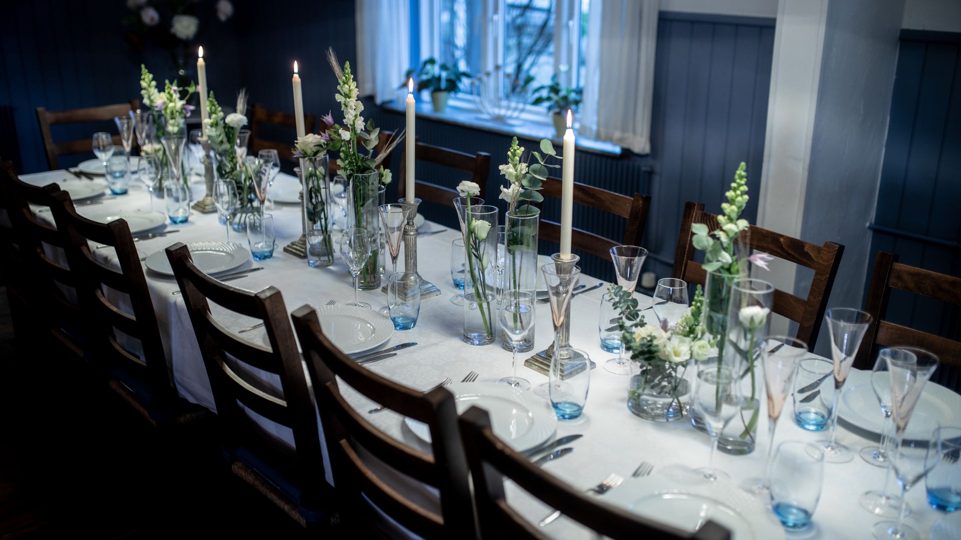 Beautifully decorated event table with floral centerpieces