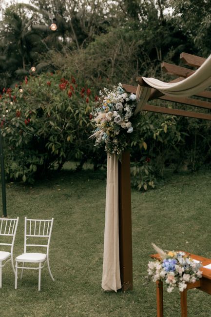 Beautiful outdoor wedding arch with floral decorations