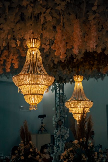 Crystal chandeliers creating a warm, inviting atmosphere